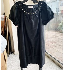 Black dress with spikes around collar